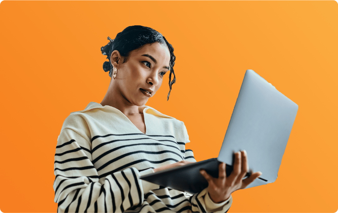 woman holding laptop